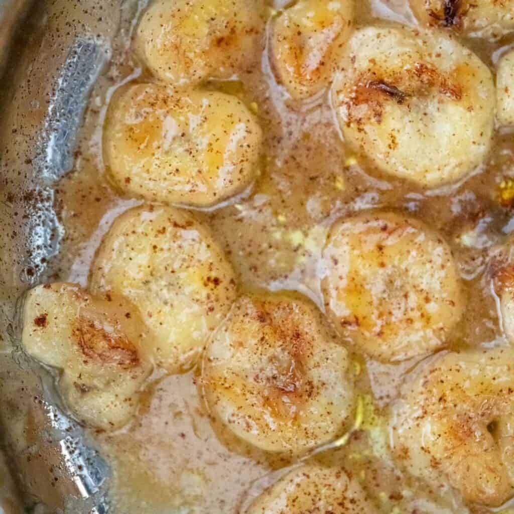 close up of caramelized bananas in pan