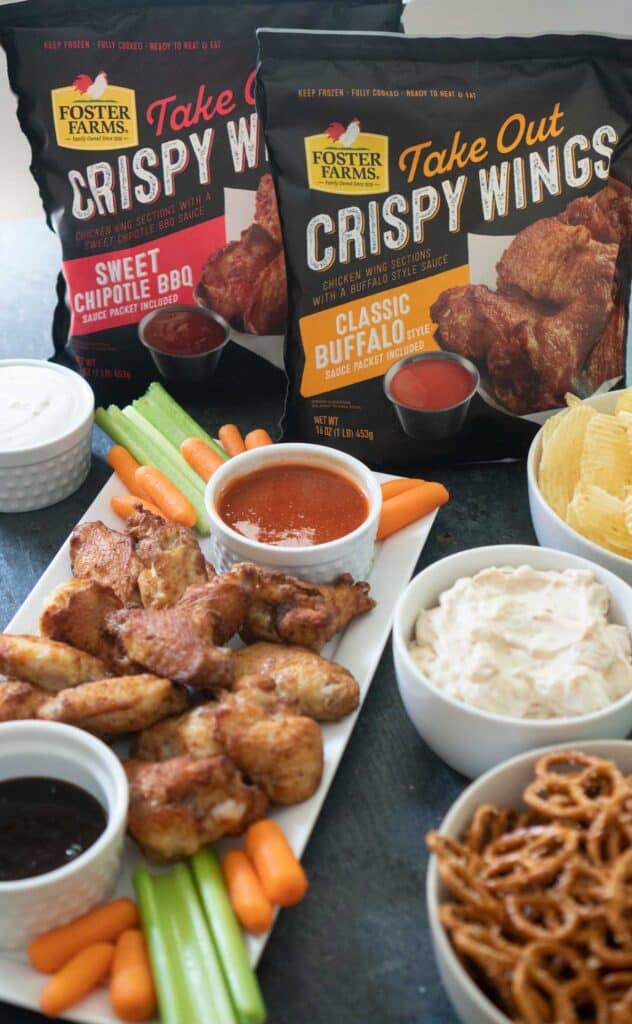 spread of snack foods including wings and pretzels