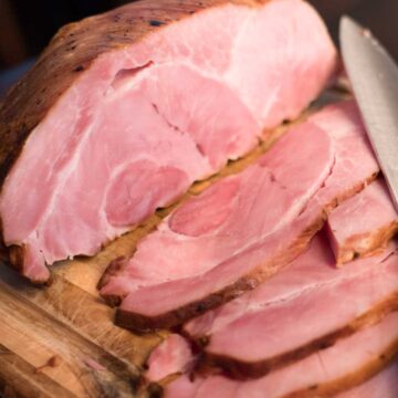 sliced ham on cutting board