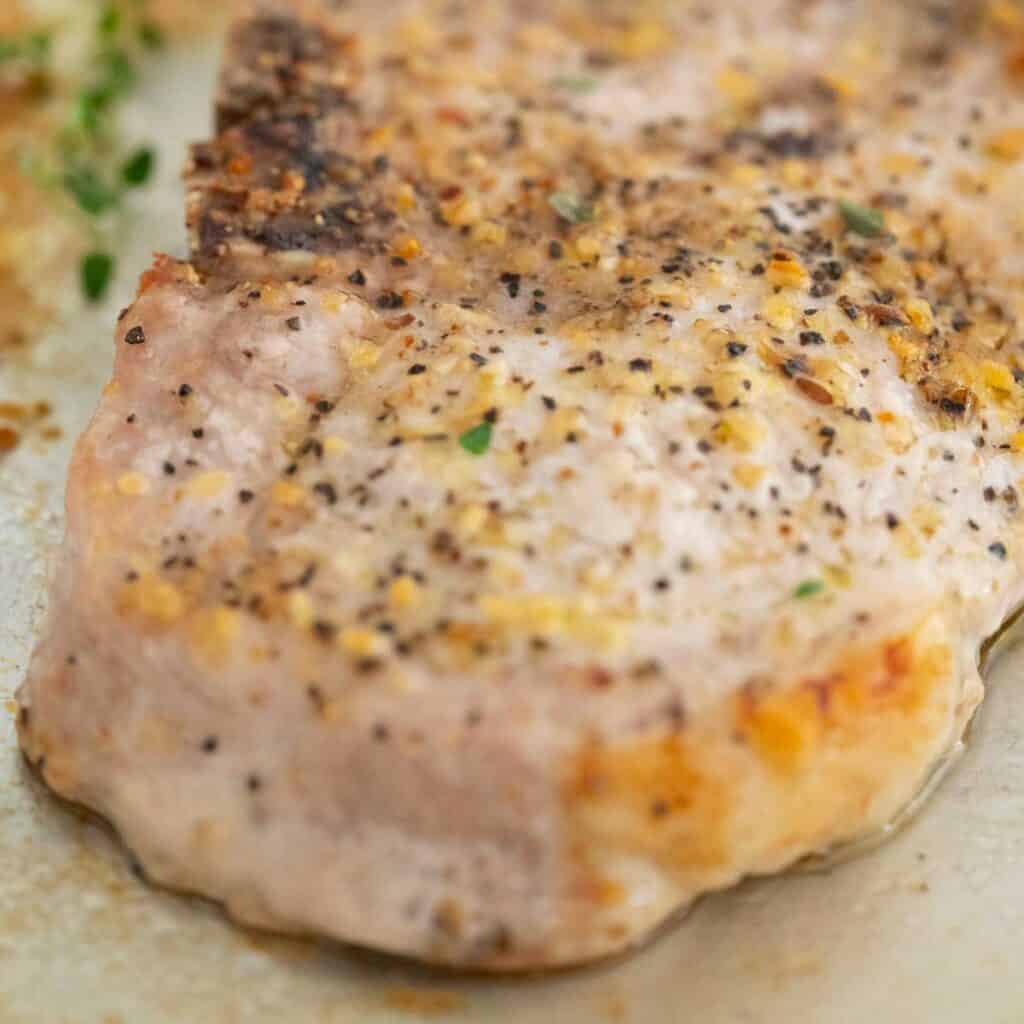 close up of baked seasoned pork chop