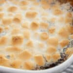close up of candied yams topped with marshmallows