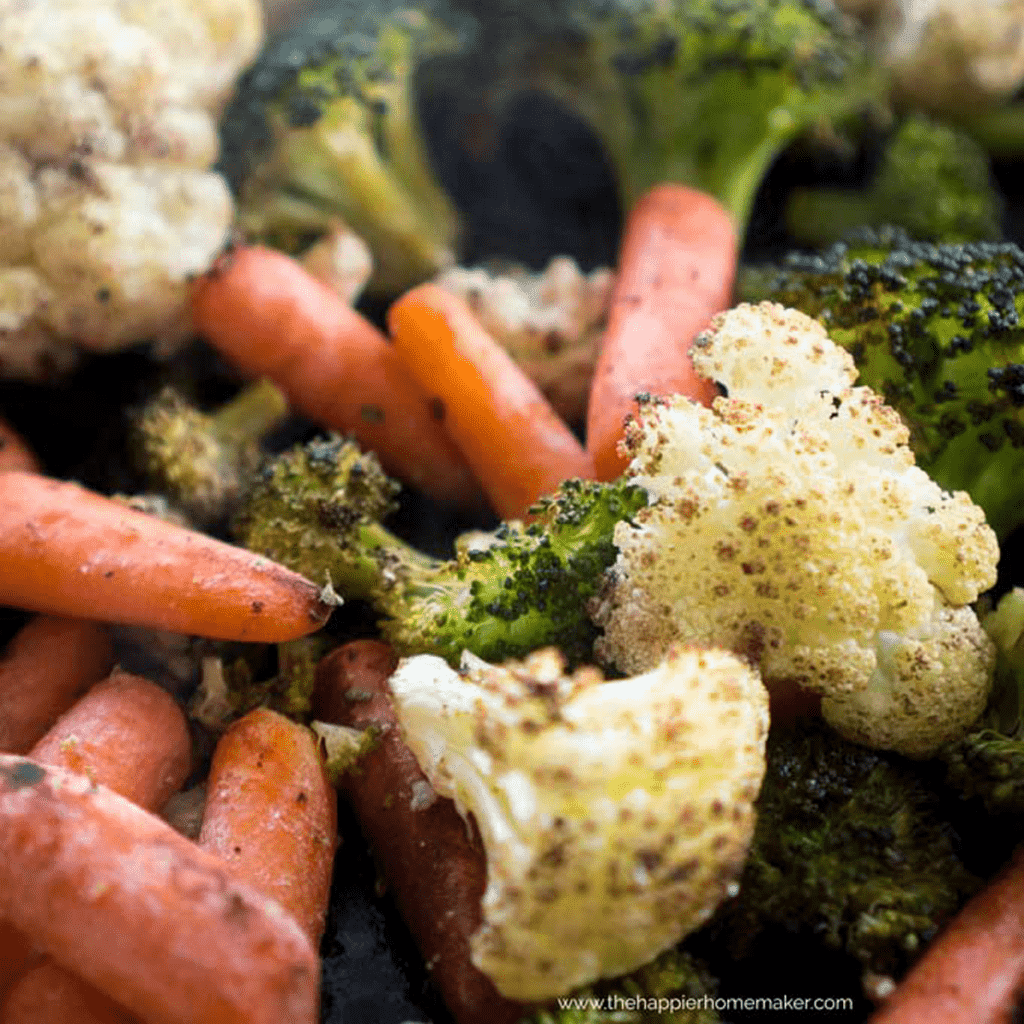 close up of roasted carrots, cauliflower, and broccoli