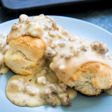 southern biscuits and gravy on a blue plate