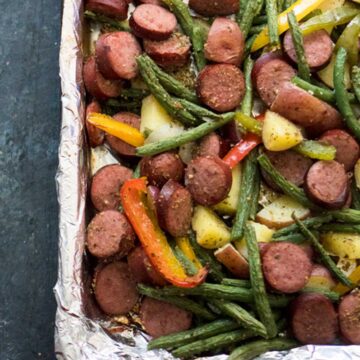 sheet pan sausage and vegetables on foil lined pan