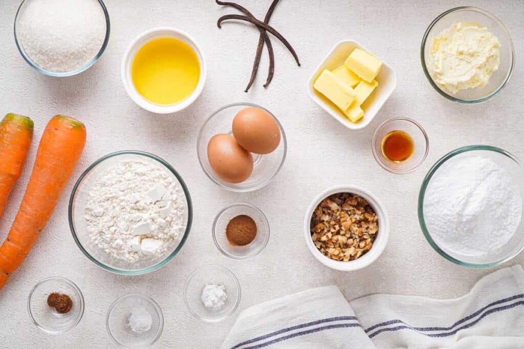 ingredient for carrot cake muffins on countertop from above