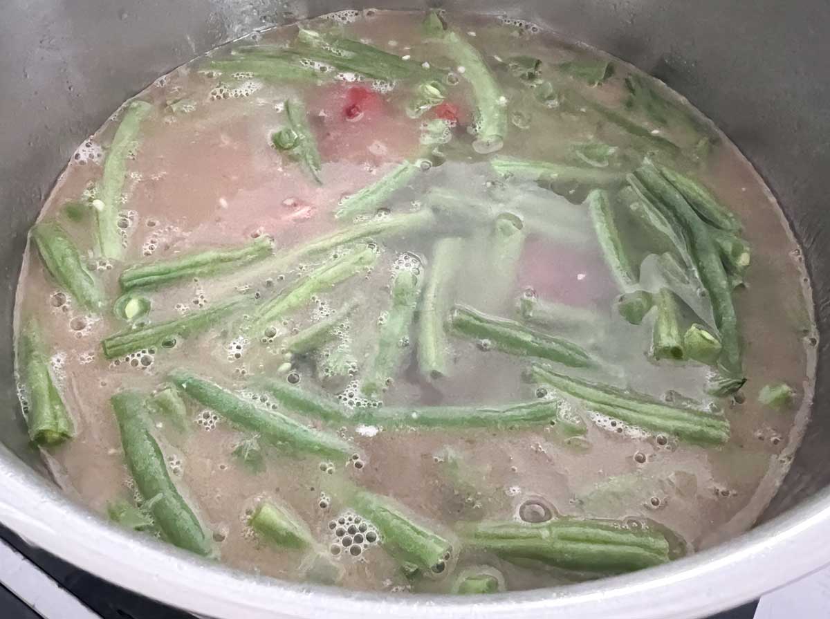 southern green beans simmering in broth