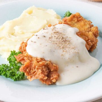 chicken fried chicken with white gravy and mashed potatoes