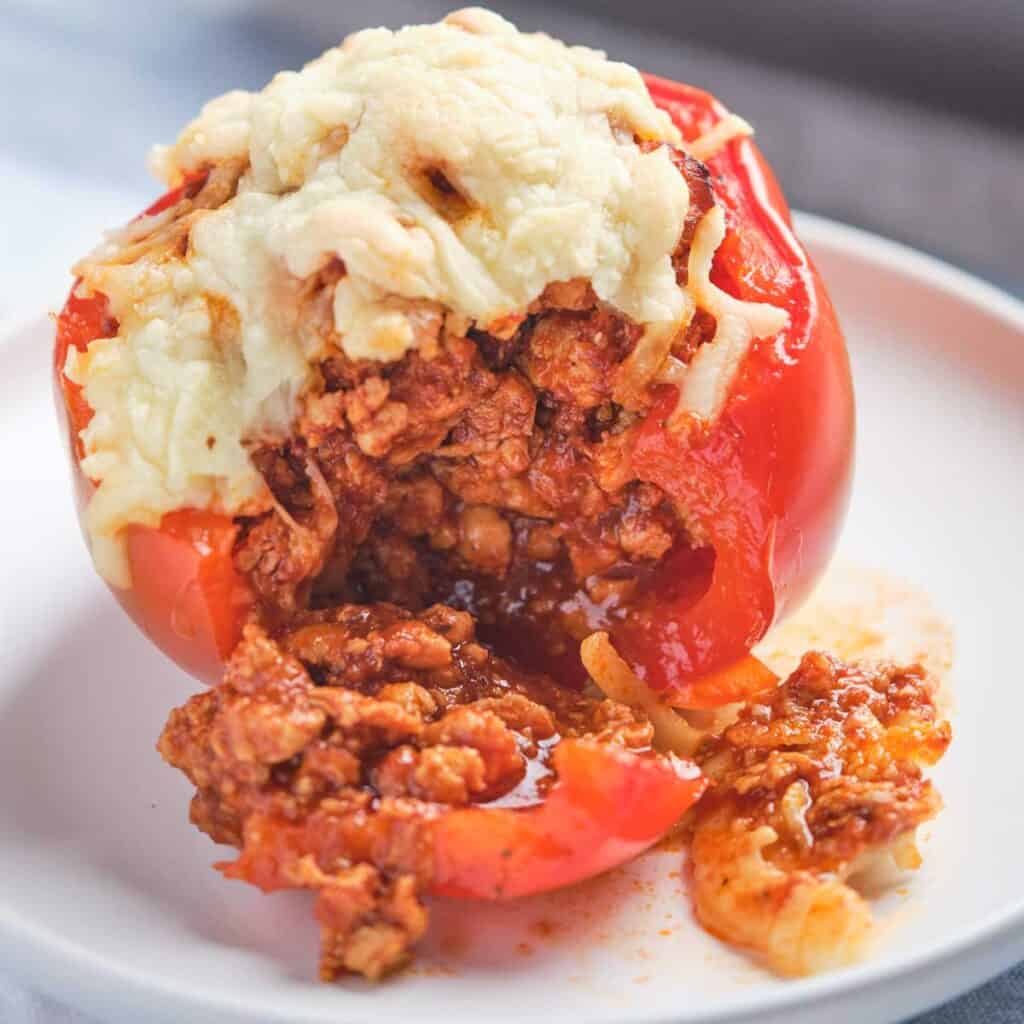 red bell pepper stuffed with ground turkey and topped with cheese