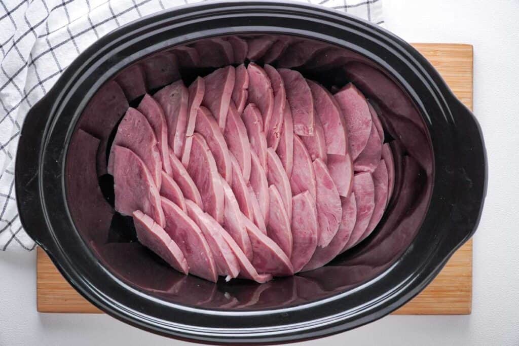 sliced ham in slow cooker