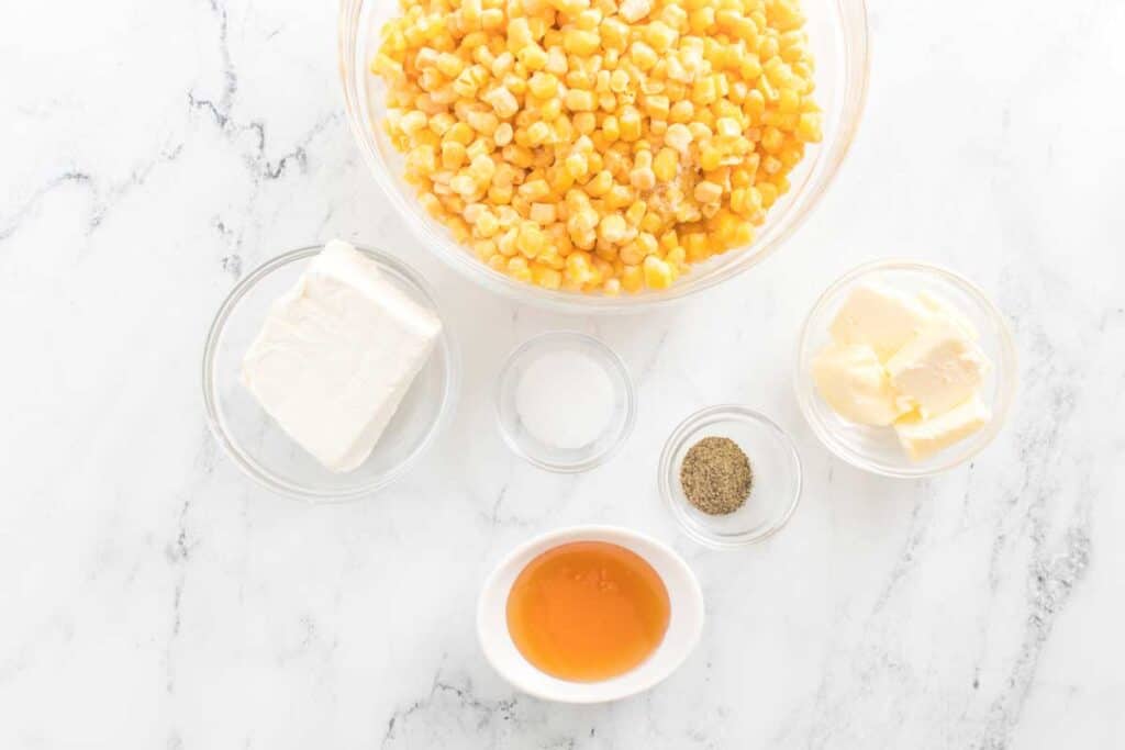 honey butter skillet corn ingredients on marble countertop