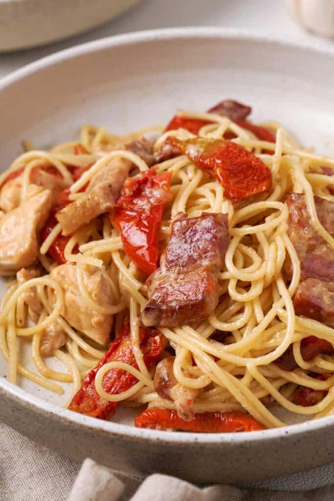 close up of tuscan chicken pasta in bowl
