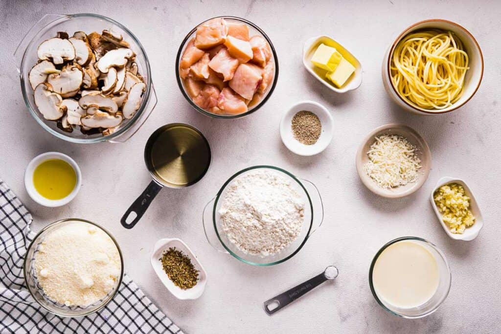 parmesan mushroom chicken ingredients on countertop