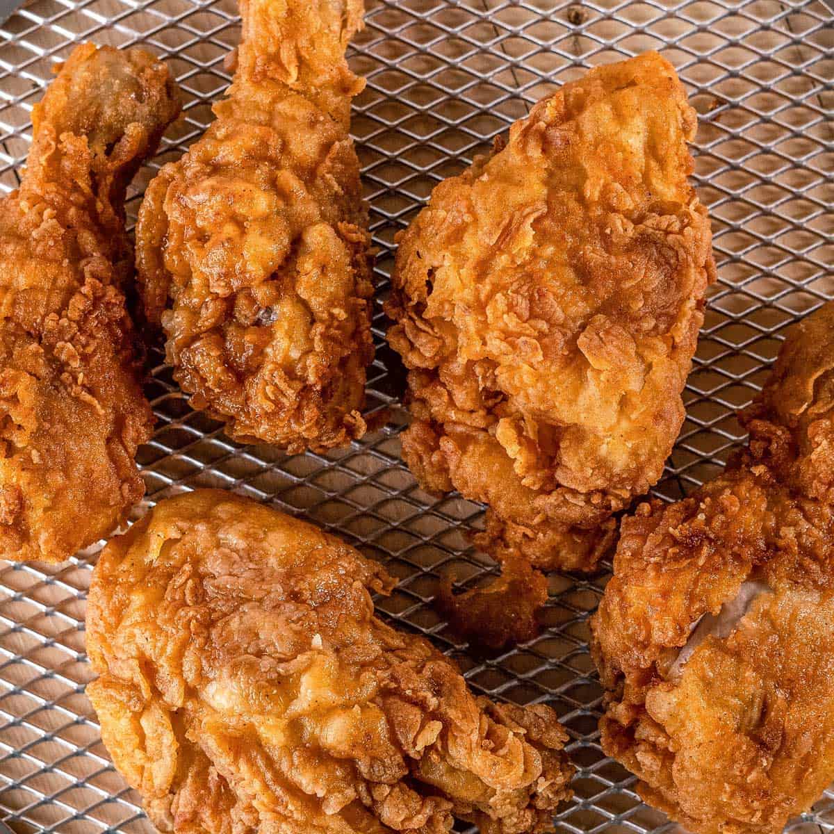 an-advertisement-for-fried-chicken-with-sticky-rice-on-a-green-plate