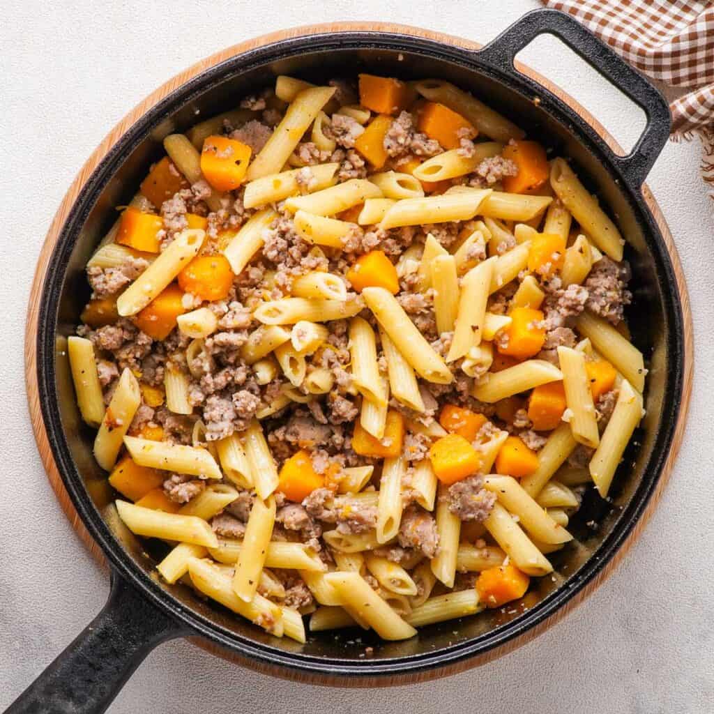 butternut squash and sausage pasta in skillet