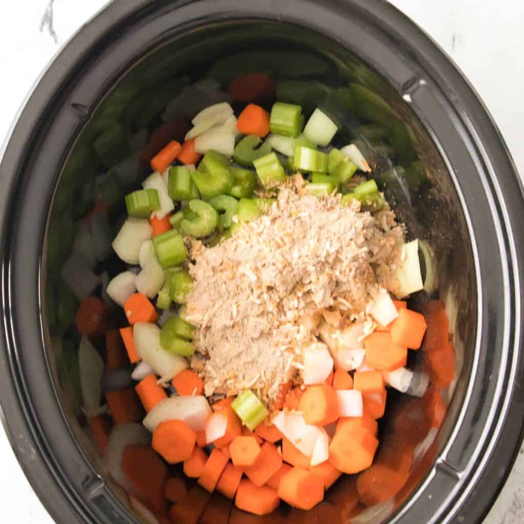 chopped vegetables and onion soup mix in slow cooker 