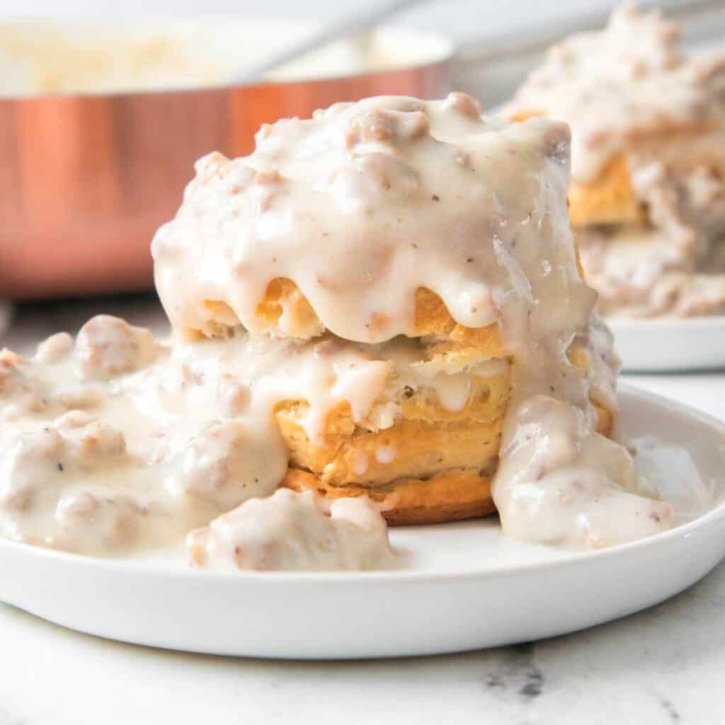 biscuits and gravy on white plate