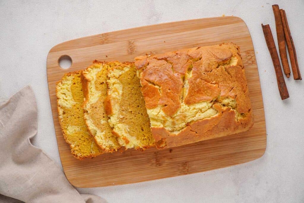 swirled cream cheese pumpkin bread on cutting board
