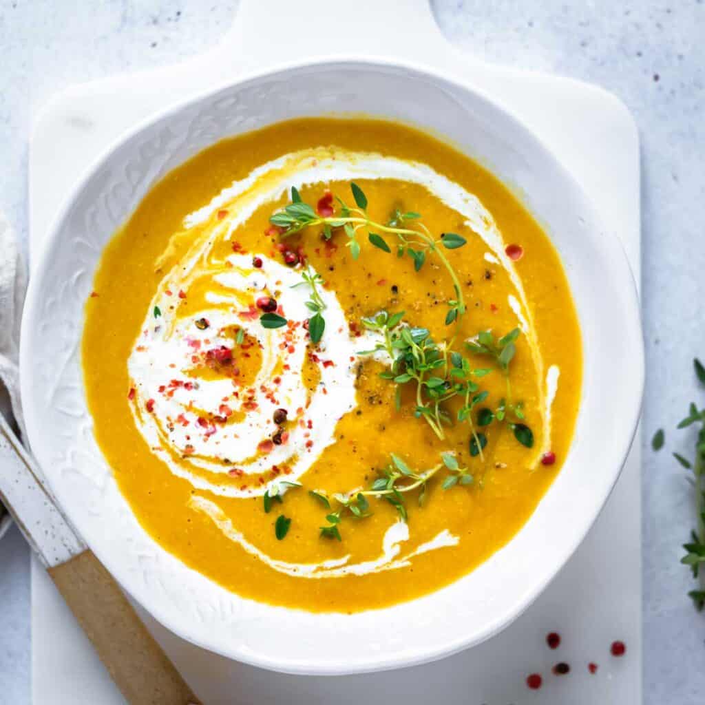 white bowl of pumpkin soup