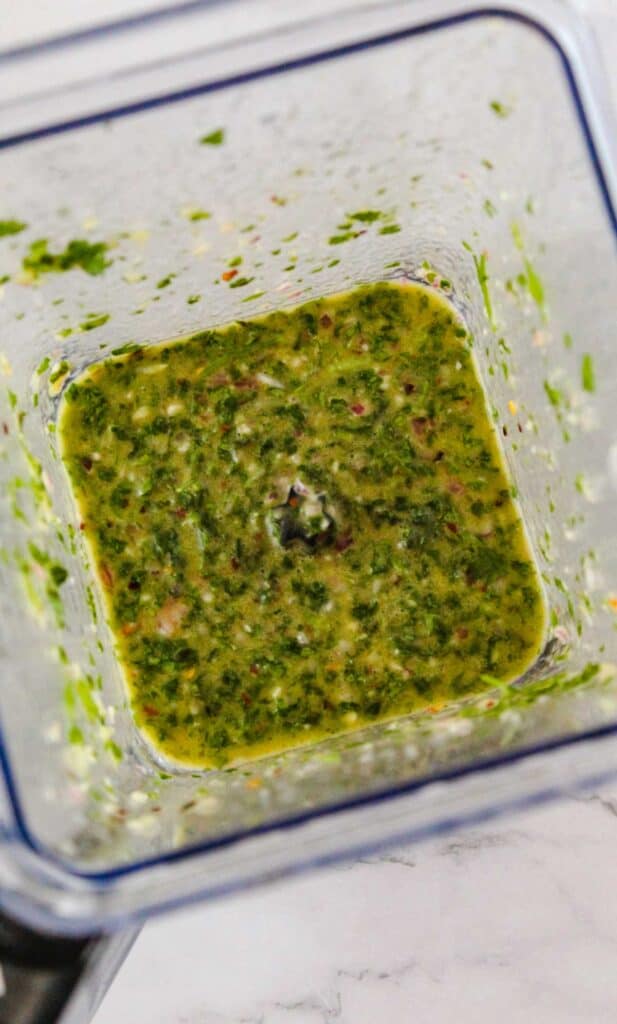 chimichurri ingredients in blender after pulsing