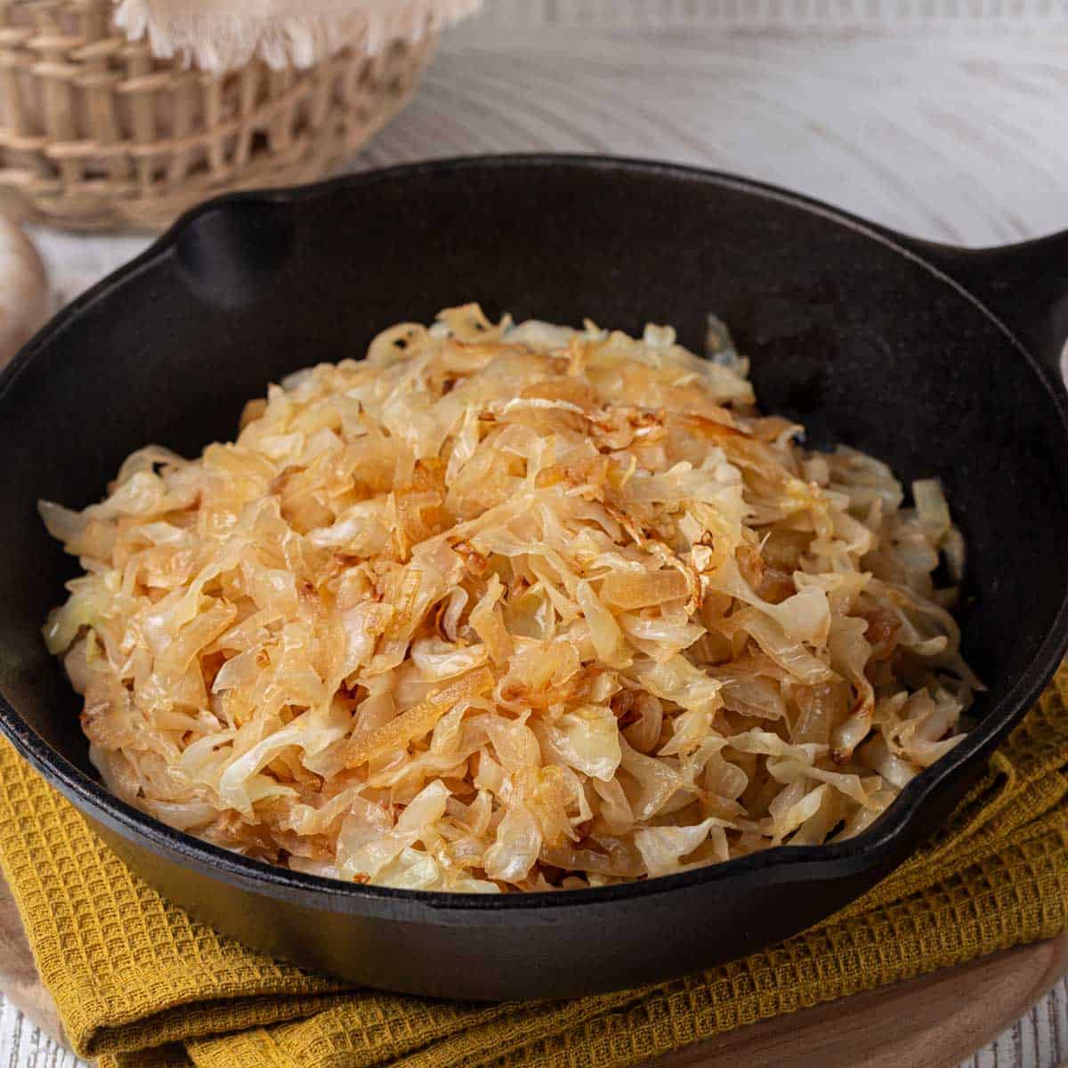 fried cabbage in cast iron pan