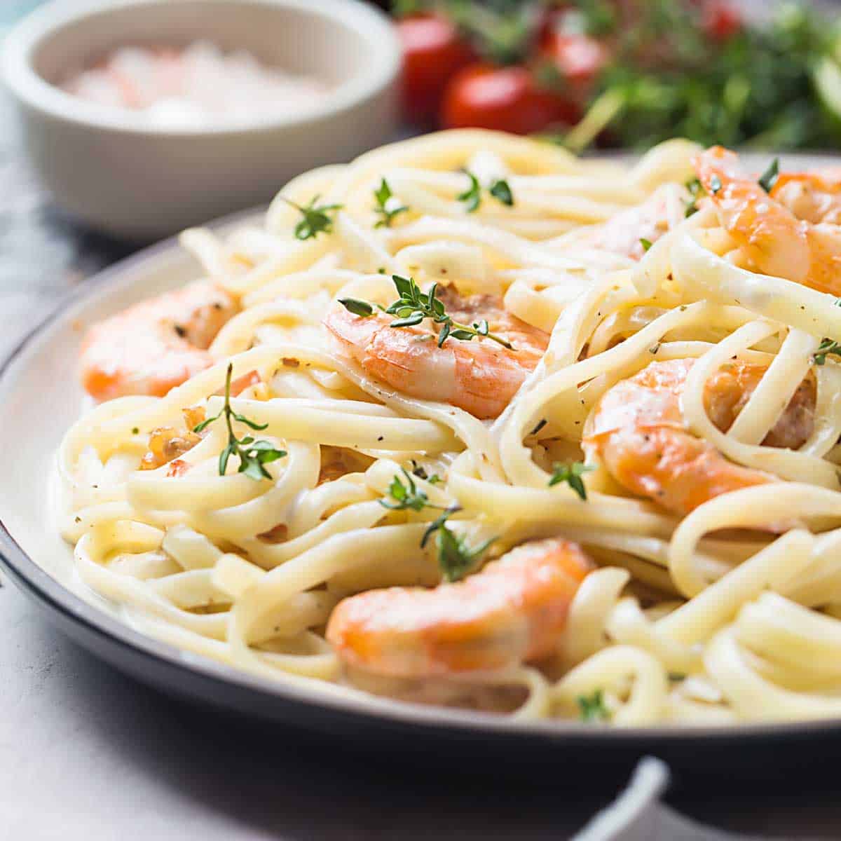 shrimp alfredo on white plate