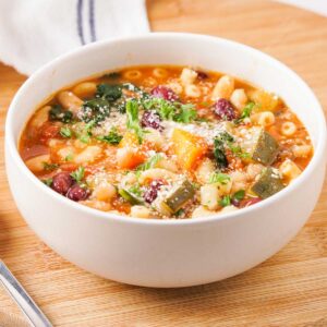 white bowl with minestrone soup