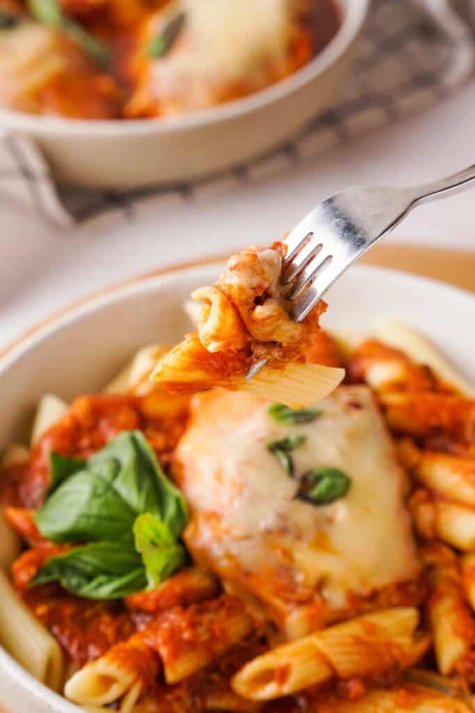 fork with bite of Instant Pot Chicken Parmesan