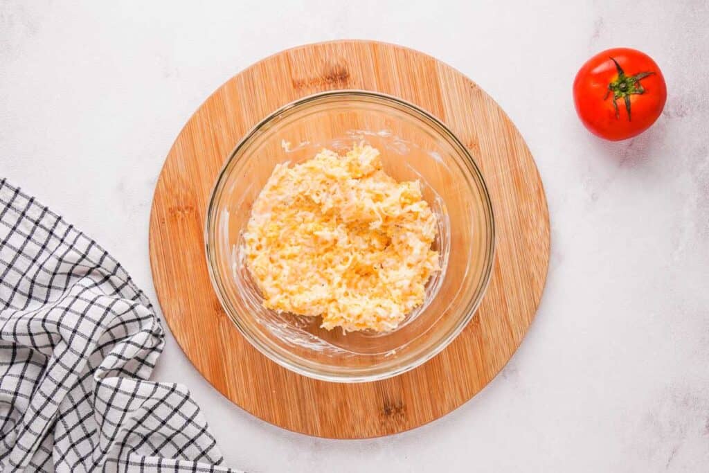 cheesy mayonnaise mixture in glass bowl