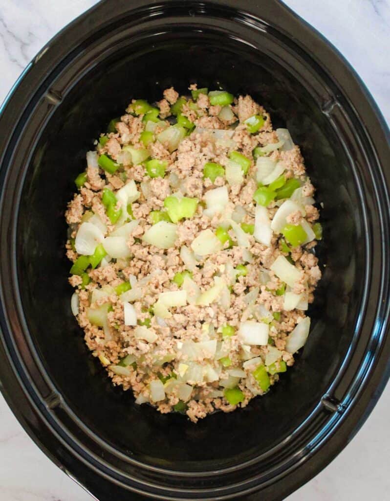 slow cooker with ground turkey, onions, and bell pepper
