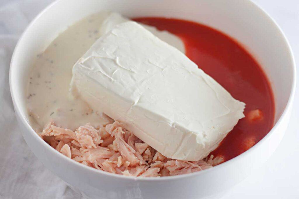 chicken cream cheese and buffalo cause in white bowl