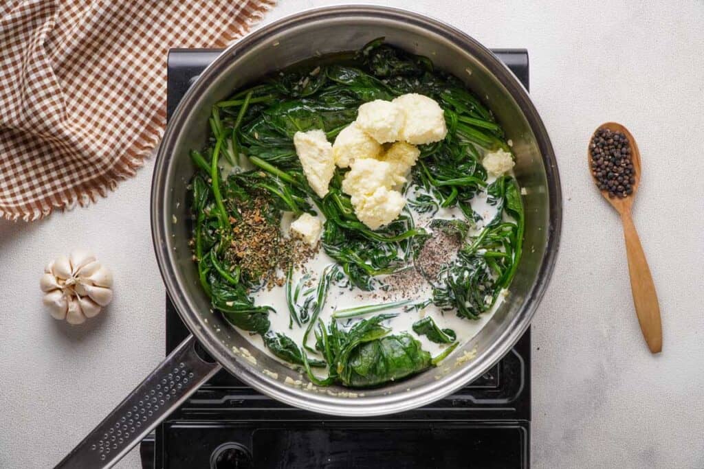 pan with creamed spinach ingredients before cooking