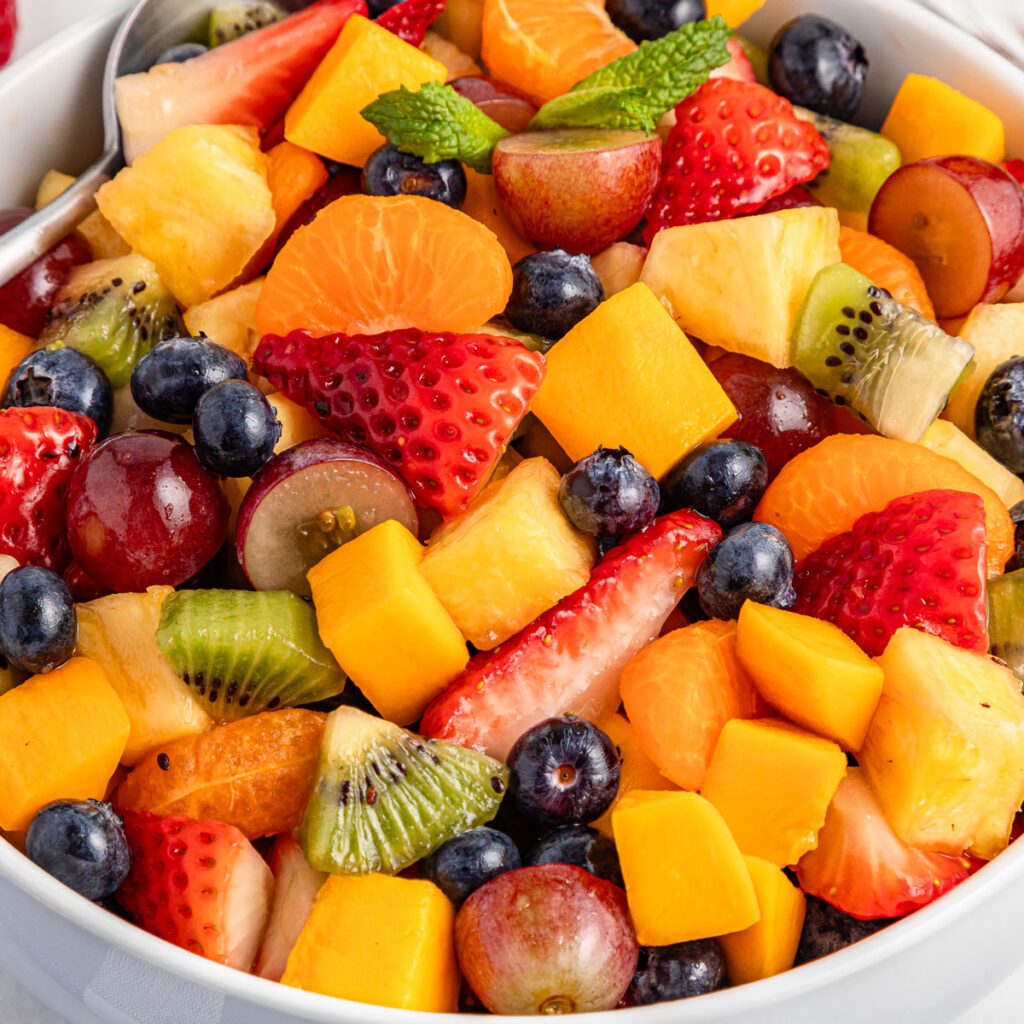fresh fruit salad in white bowl