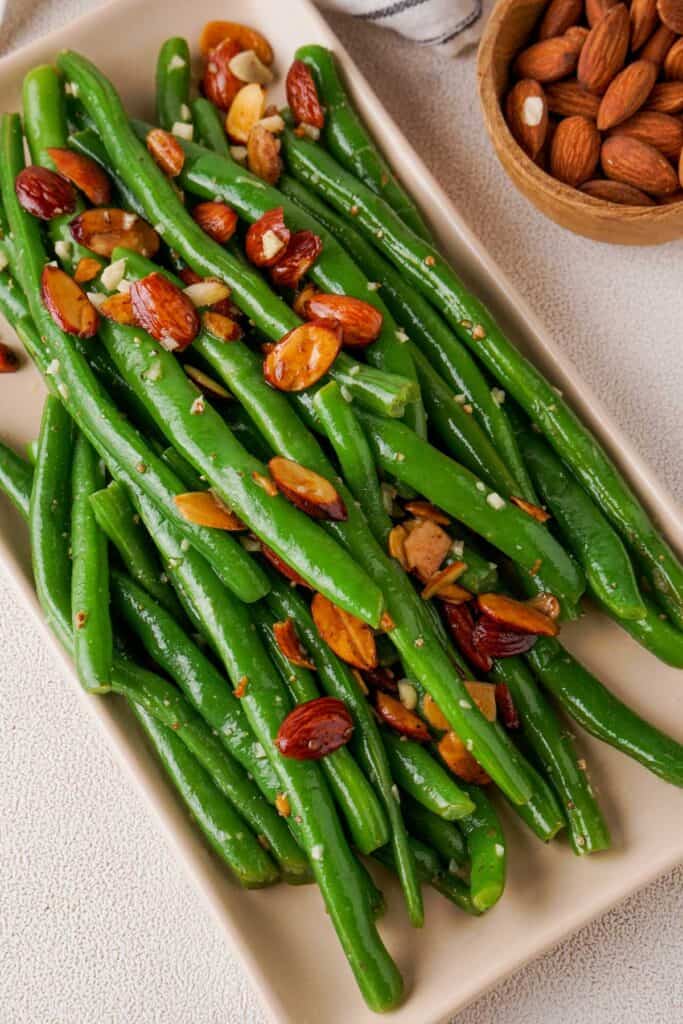 green beans almondine on a rectangle plate