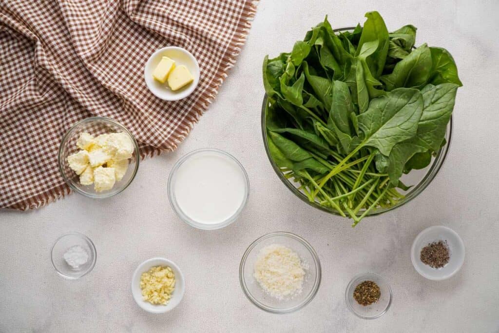 creamed spinach ingredients on marble countertop