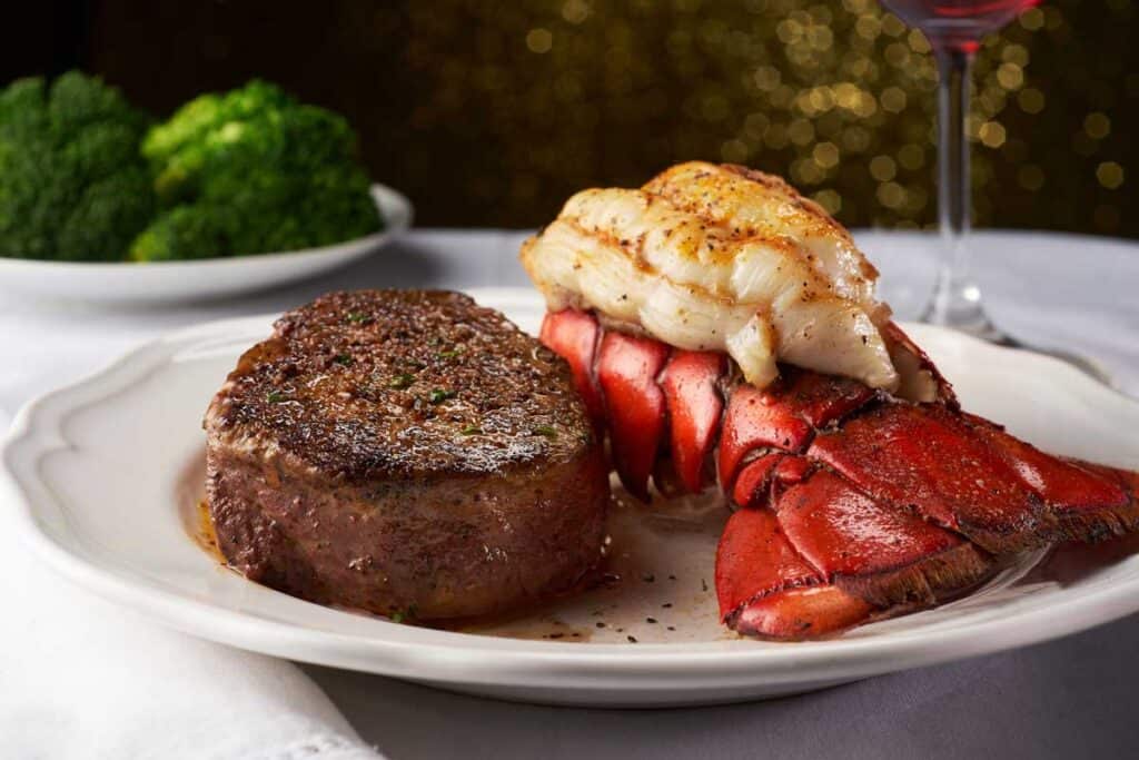 steak and lobster tail on white plate