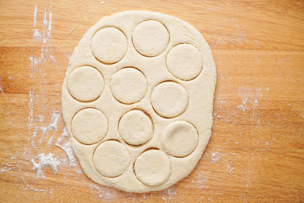 biscuit dough with circles cut into it