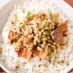 black-eyed peas over white rice in bowl