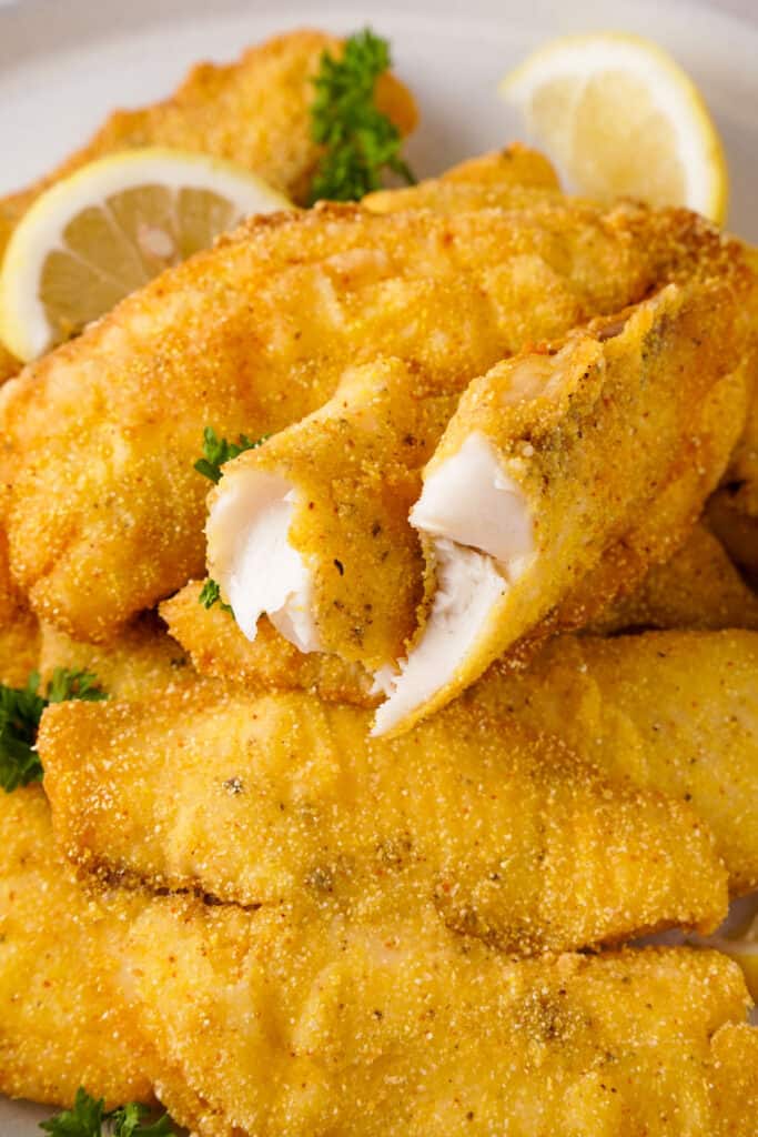 crispy fried catfish with one piece cut in half