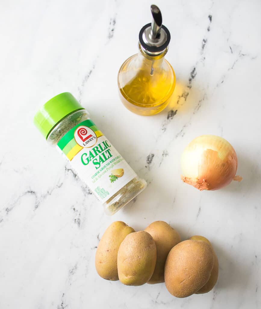 air fryer potatoes ingredients on marble countertop