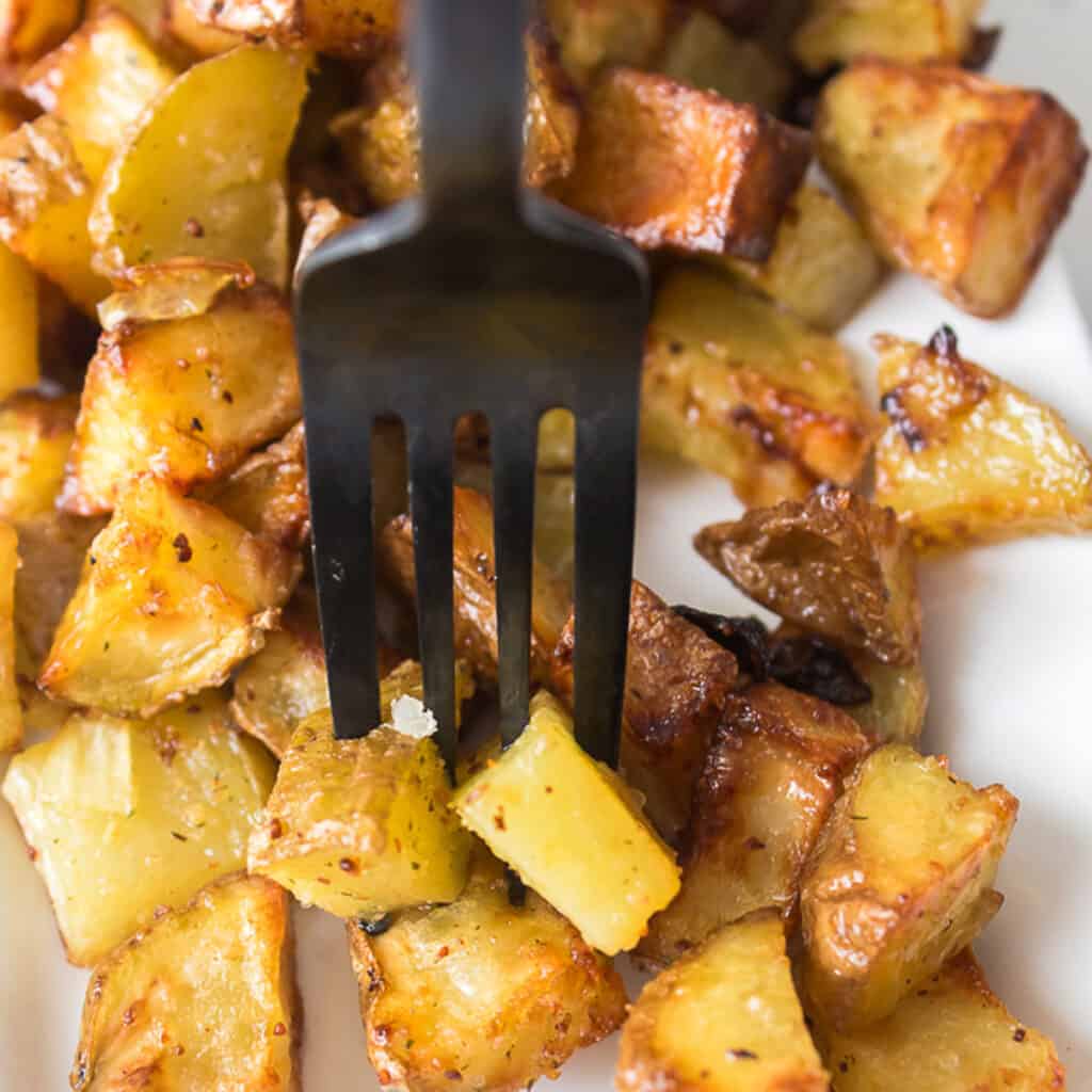 fork piercing crispy air fryer potatoes