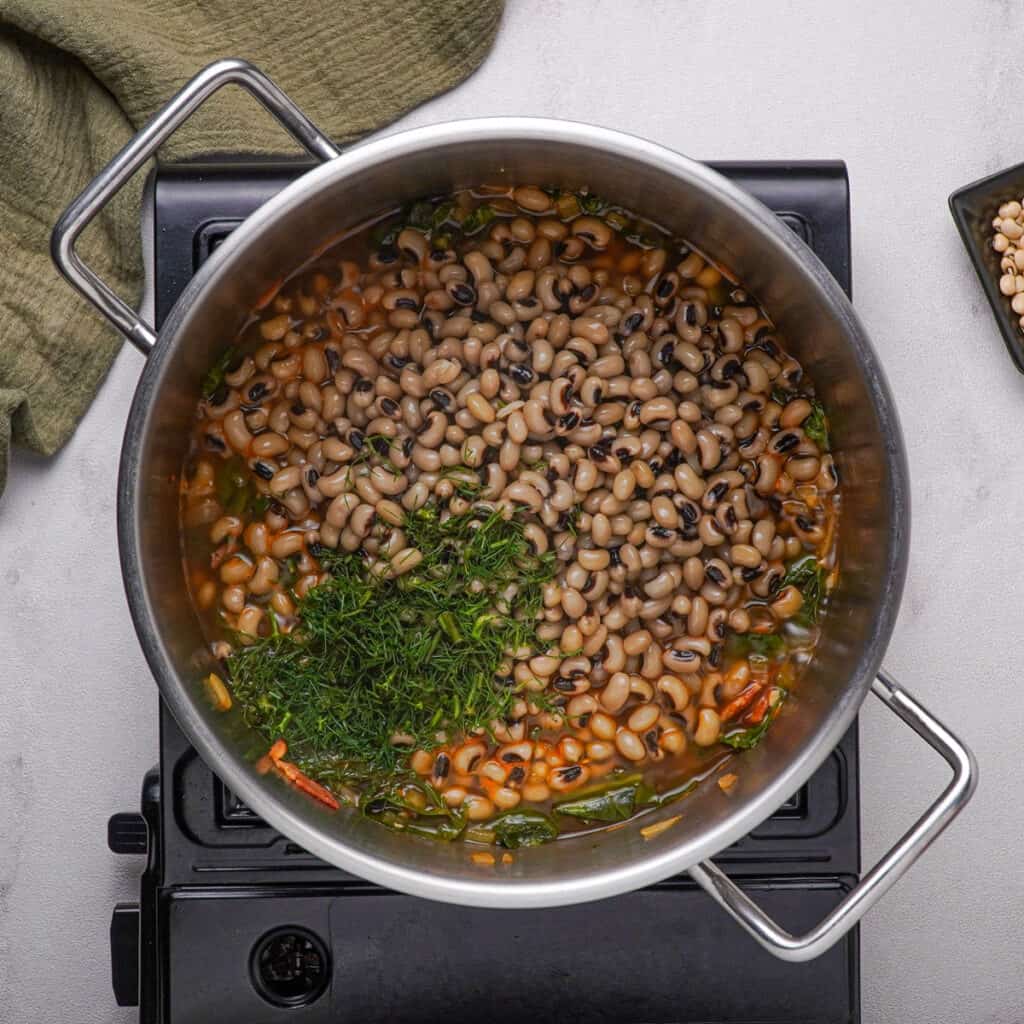 black-eyed peas and herbs in pot