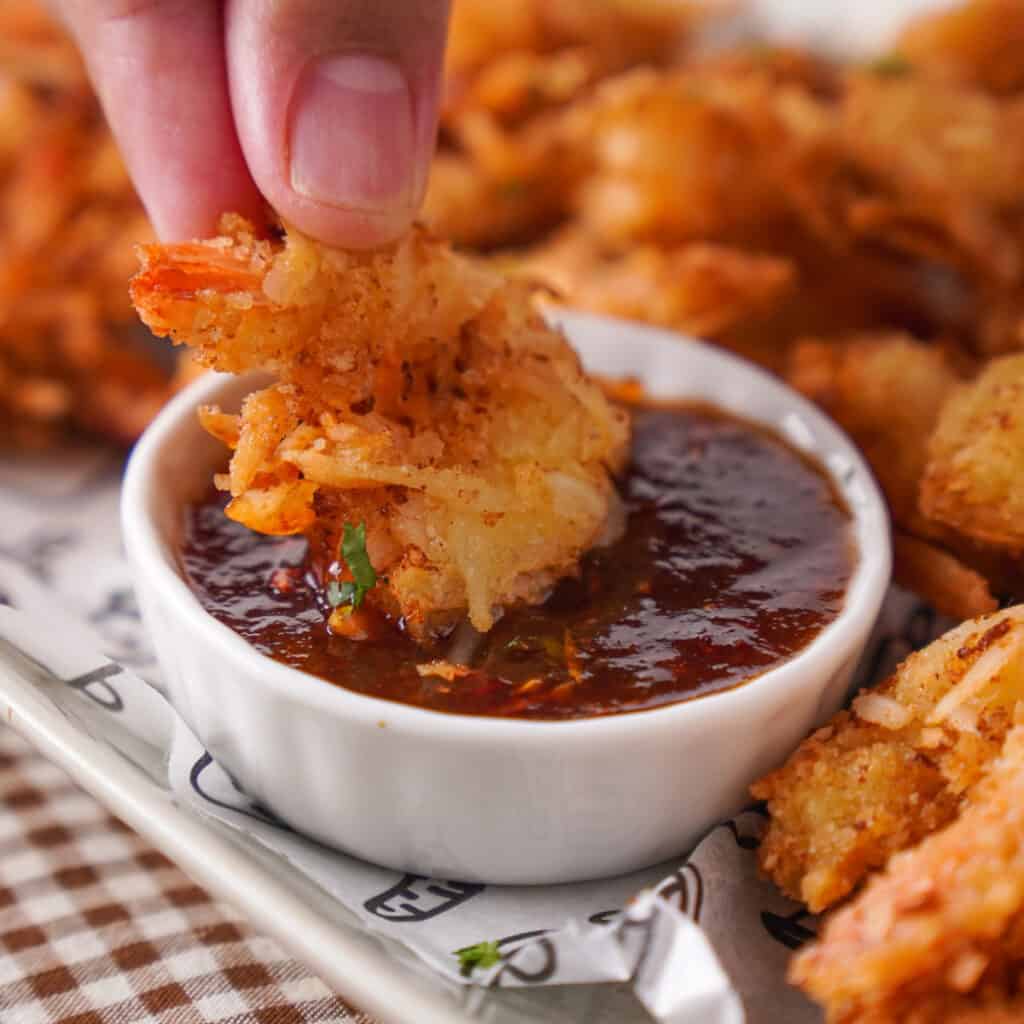 sipping coconut shrimp in apricot chili sauce