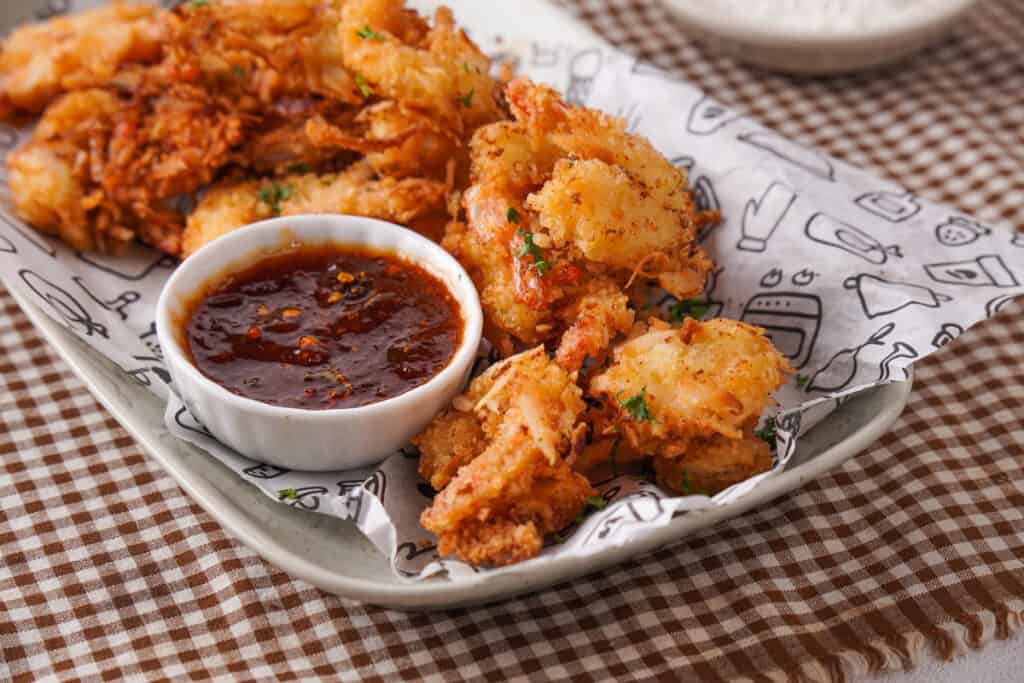 coconut shrimp on lined metal tray
