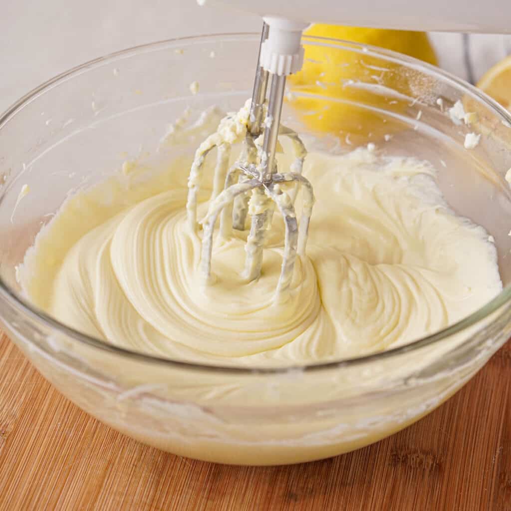 mixing lemon lush layer ingredients with electric mixer