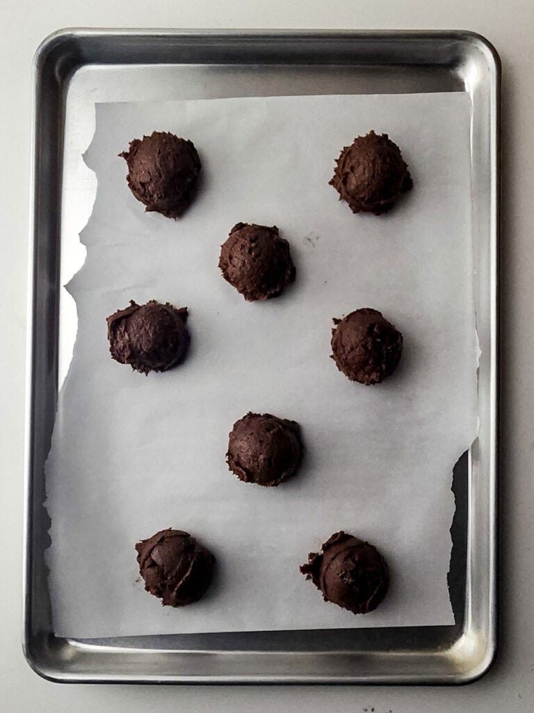 brownie cookie batter balls on baking tray