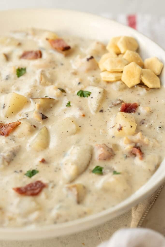 bowl of New England clam chowder with oyster crackers