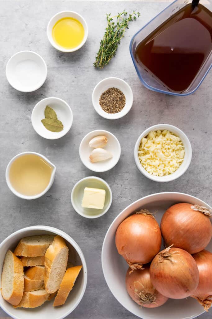 french onion soup ingredients in bowls on counter