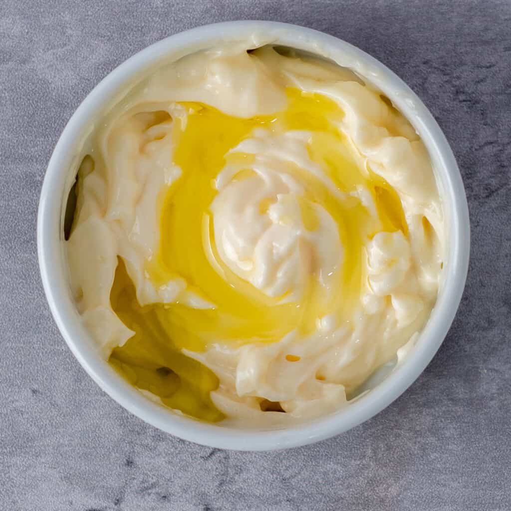 mayonnaise and truffle oil in small bowl