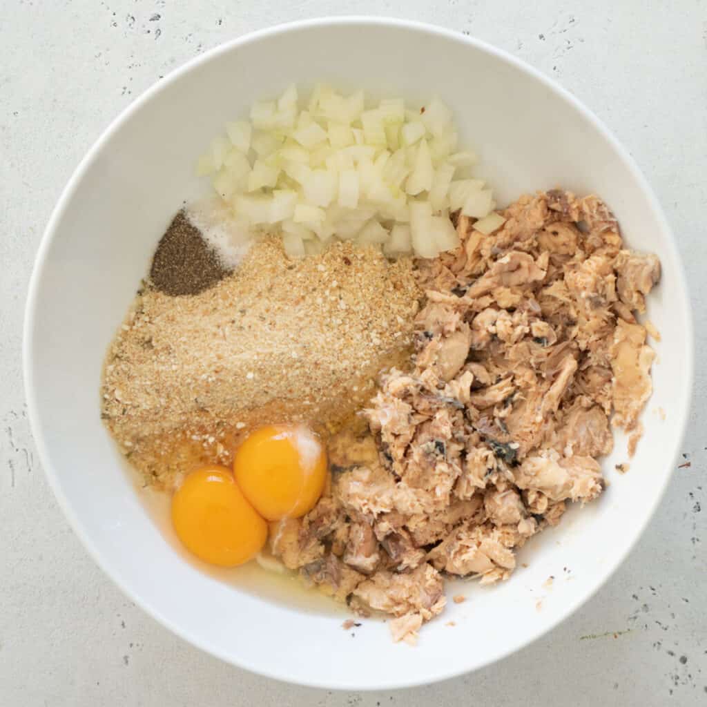 salmon patties ingredients in white bowl