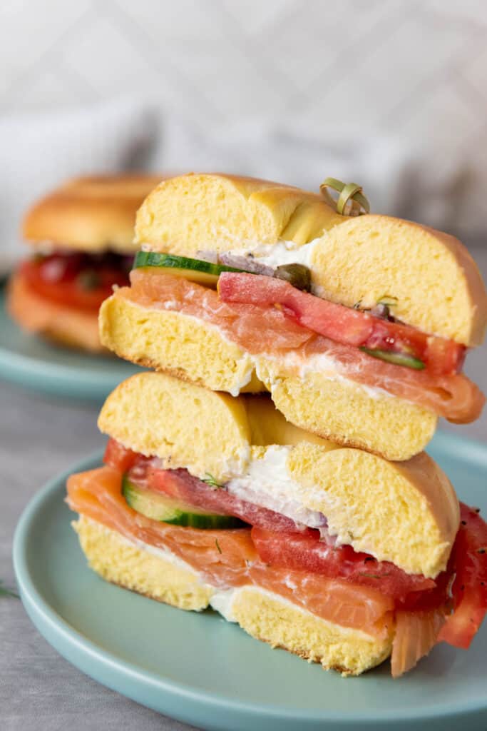 two smoked salmon bagel halves stacked on each other